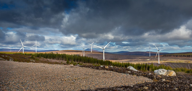 Wind turbines at Clashindarroch Wind Farm, showing turbine blades rotating